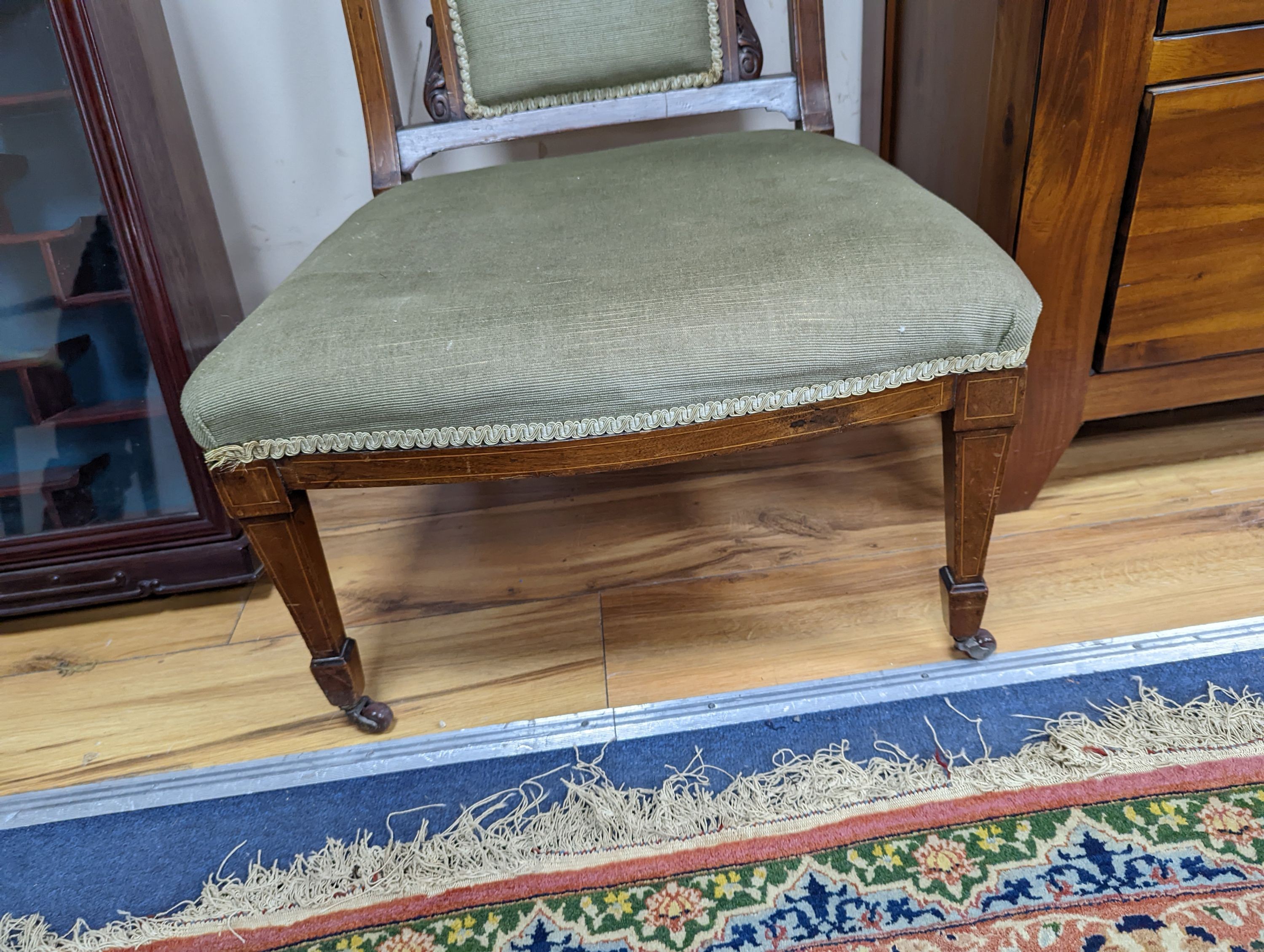 A late Victorian marquetry inlaid mahogany nursing chair